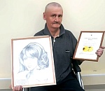 Постоялец астраханского дома-интерната удостоился памятной медали за работу на выставке в Совете Федерации России